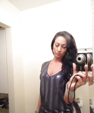 18 year old girl Megan Rain removes her sandals and then clothes to pose naked